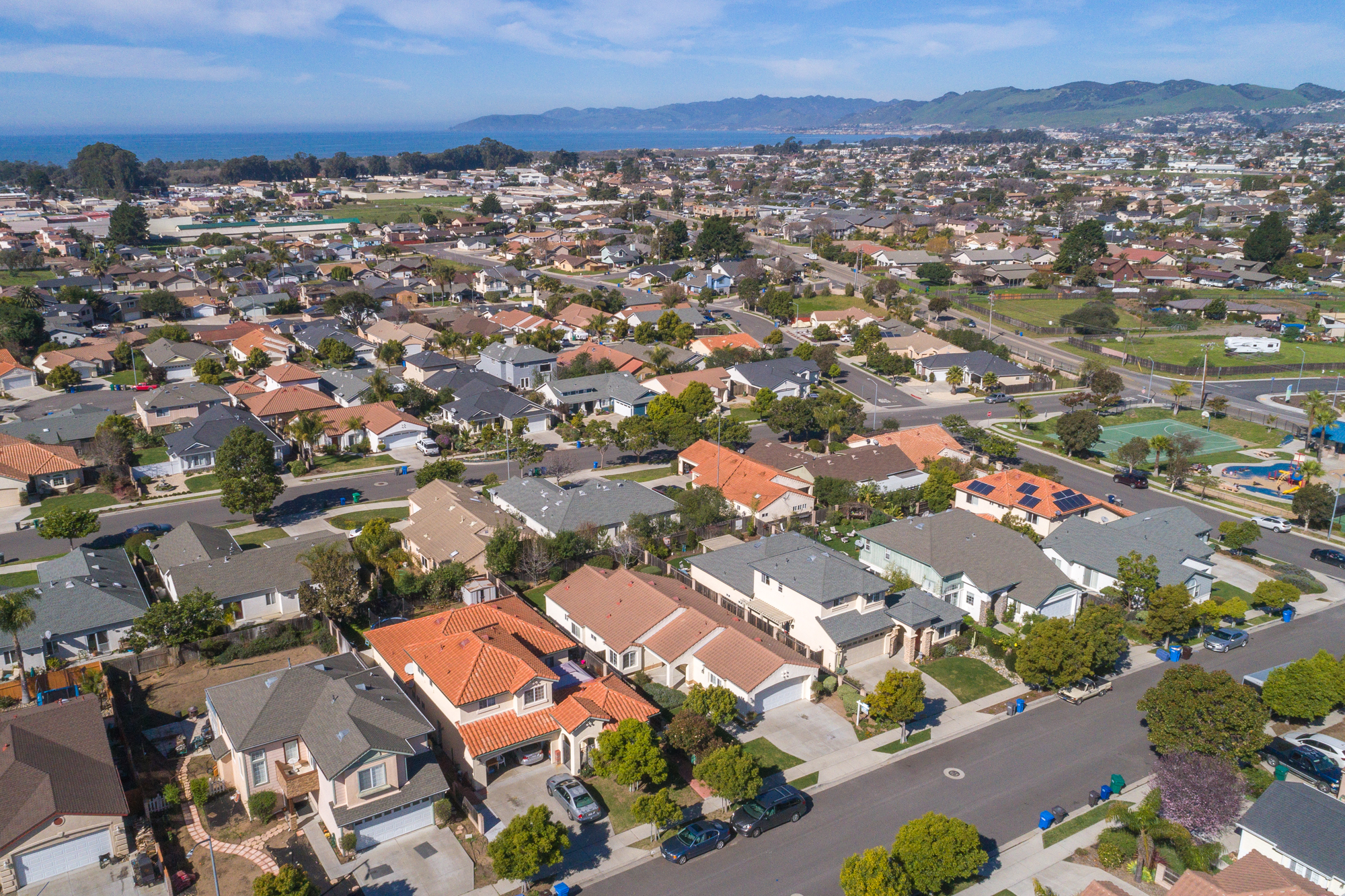 Angled aerial photo of a Central Coast home and surrounding lot